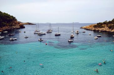 Aerial shot of the beach near Ibiza full od boats and people An aerial shot of the beach near Ibiza full od boats and people