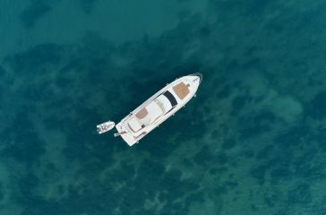 Aerial view on the sea and boat. Beautiful natural seascape at the summer time Sailboat in the sea in the evening sunlight over beautiful sea background, luxury summer adventure, active vacation in Mediterranean sea, Turkey